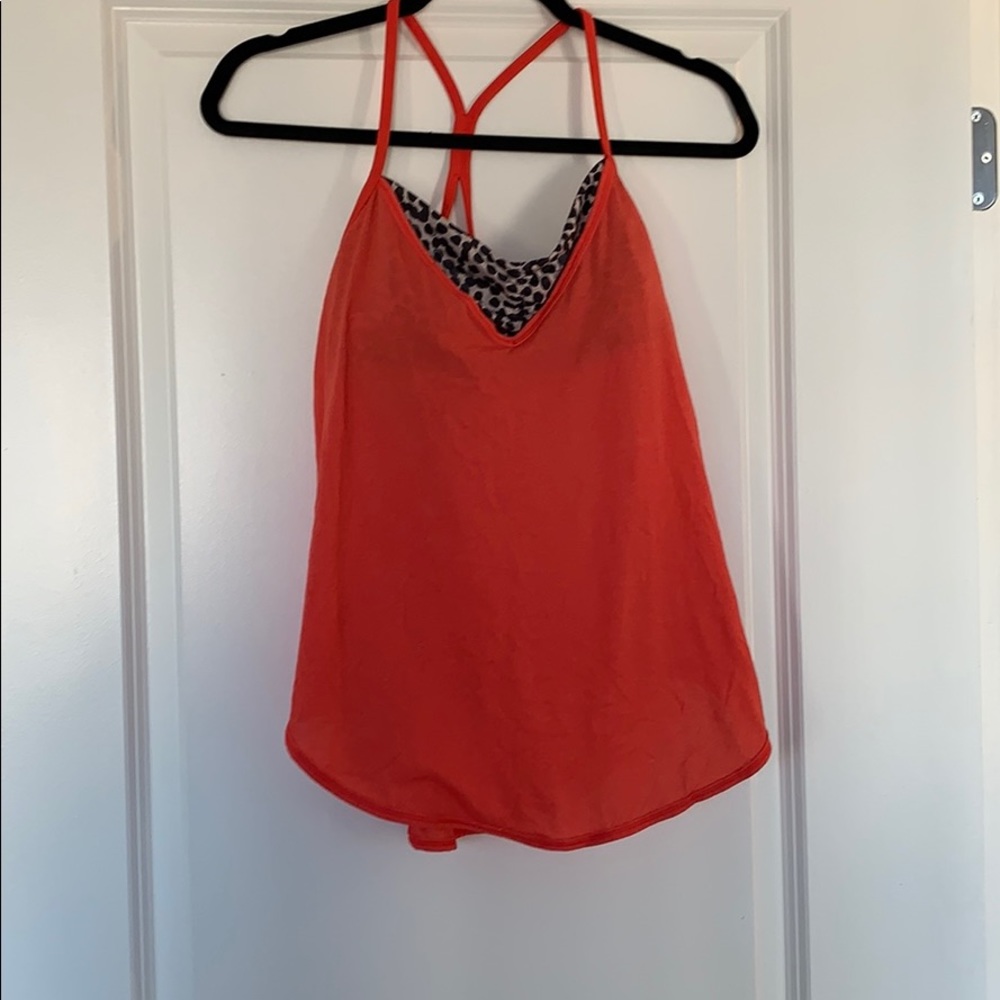 Peach Lululemon workout tank with built in bra